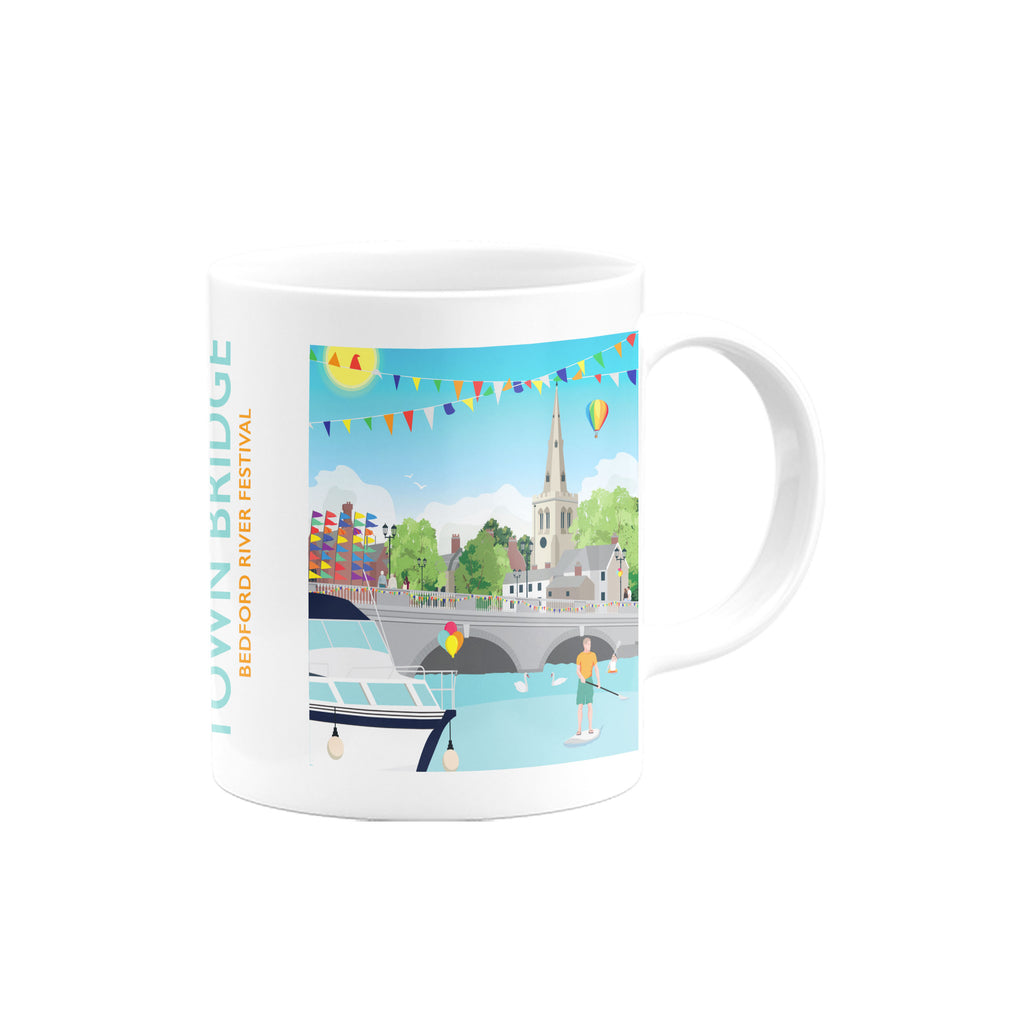 a white coffee mug with a picture of a bridge in the background
