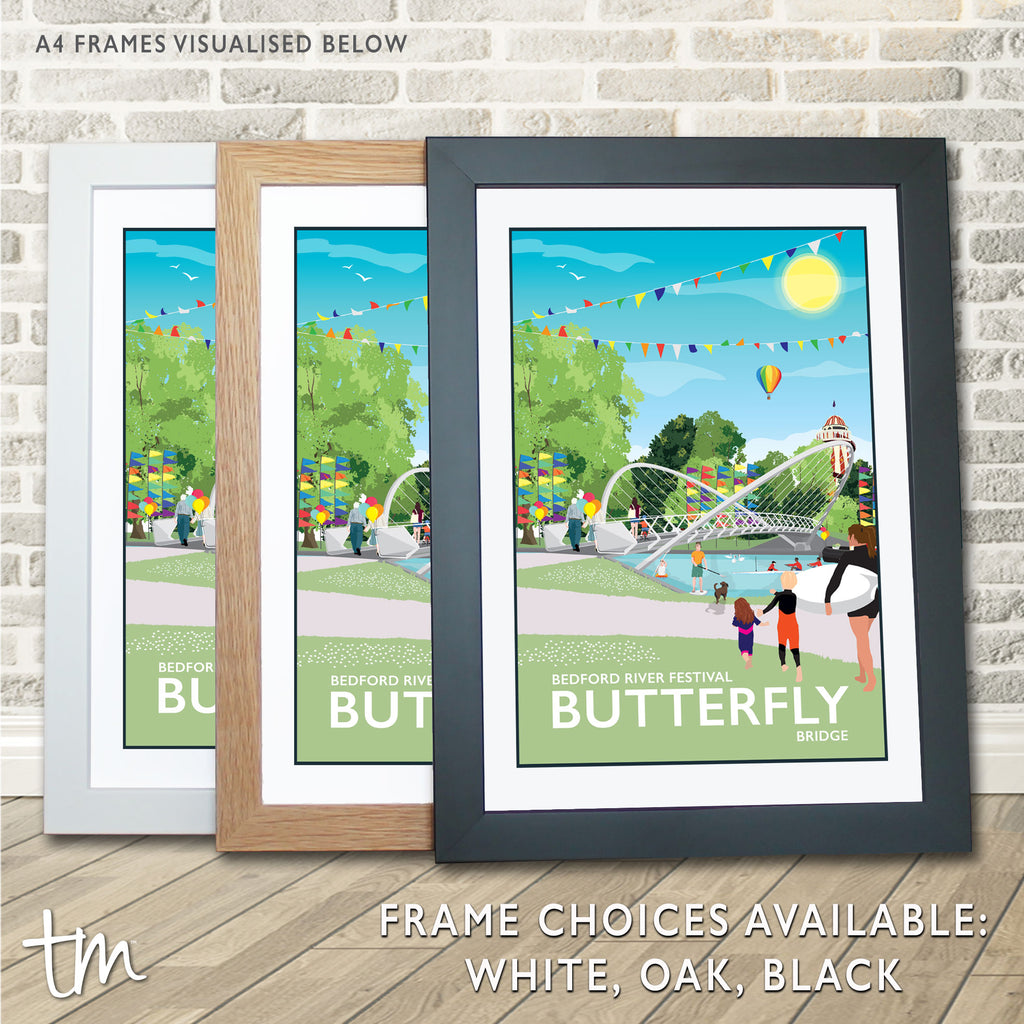 a couple of framed pictures sitting on top of a wooden floor